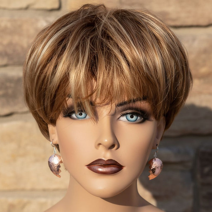 Handmade Sculpted Copper Broken Heart Earrings worn by a mannequin with a stylish haircut and makeup.