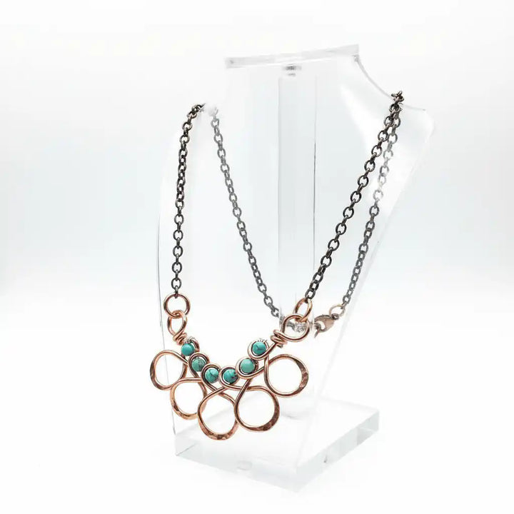 Seen on Ashley Liao Copper Turquoise Wire Wrapped Necklace displayed on a clear mannequin bust.