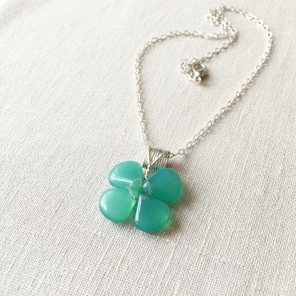 Mint green beaded clover necklace featuring Czech glass beads on a sterling silver chain.