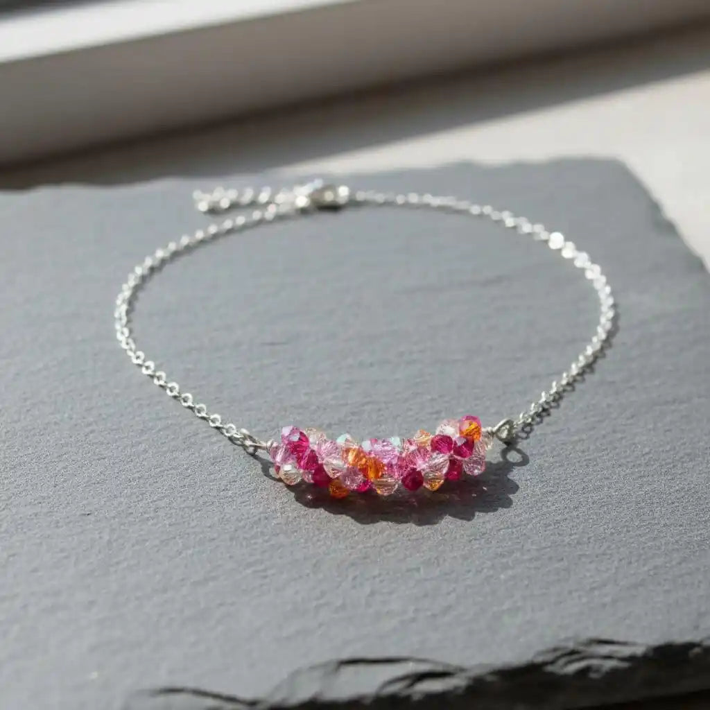 Silver Multi Color Spring Blossom Crystal Necklace featuring vibrant pink and orange Swarovski crystals on a silver chain.