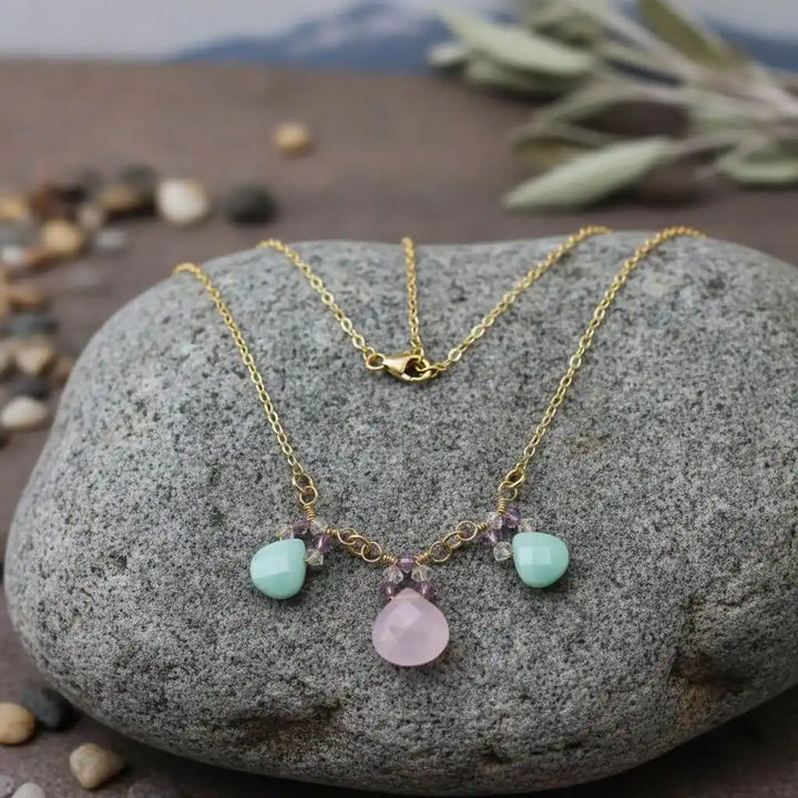 Gold Filled Light Pink and Mint Chalcedony Chain Necklace on a stone background with natural elements.