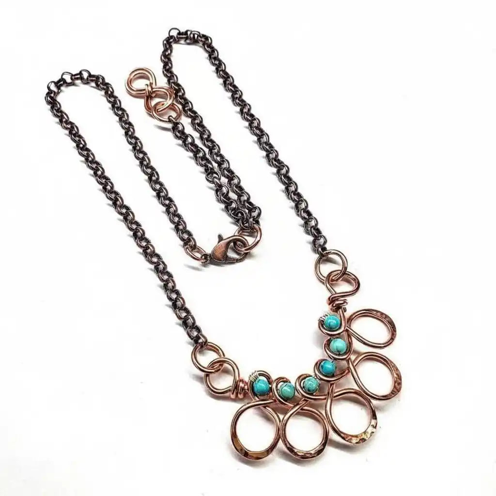 Seen on Ashley Liao Copper Turquoise Wire Wrapped Necklace features a unique design with turquoise stones and copper chains.