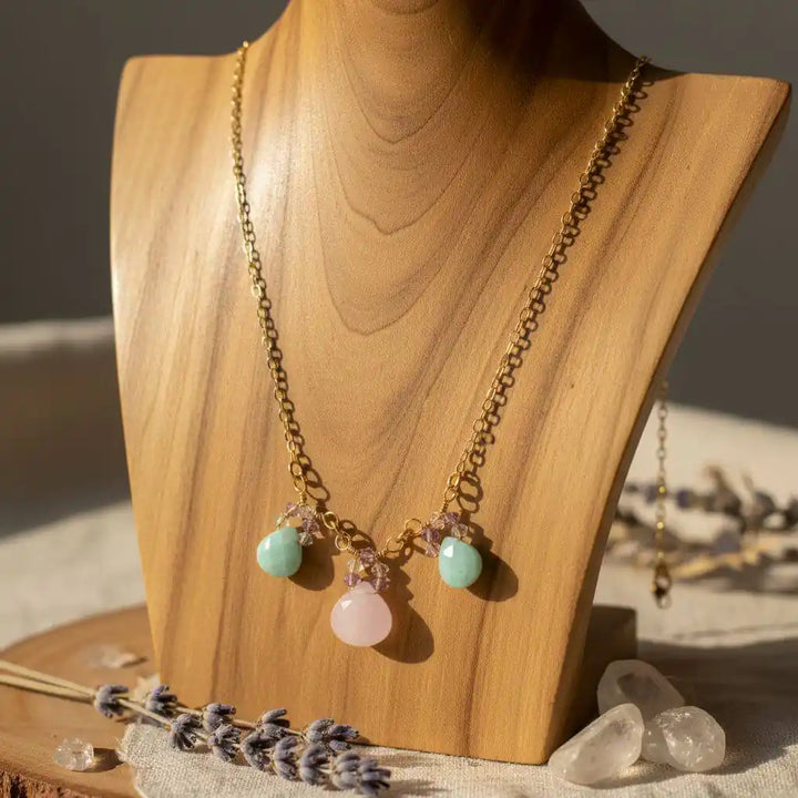 Gold Filled Light Pink and Mint Chalcedony Chain Necklace displayed on a wooden bust with briolette drops.