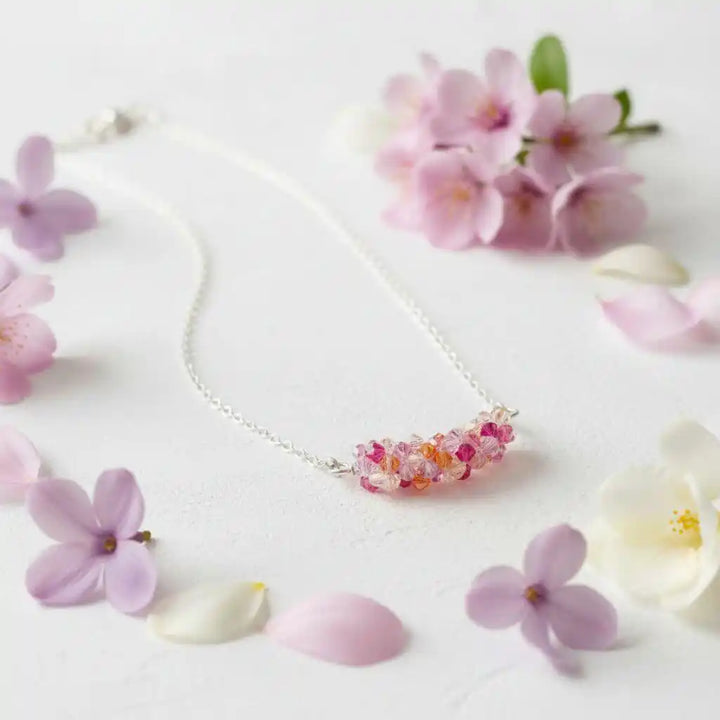 Silver Multi Color Spring Blossom Crystal Necklace with vibrant crystals surrounded by delicate flowers.