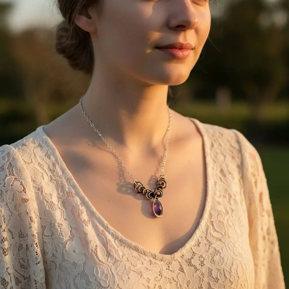 Silver and Copper Wire Sculpted Purple Crystal Drop Necklace worn by a woman, showcasing its unique design and sparkling crystal.