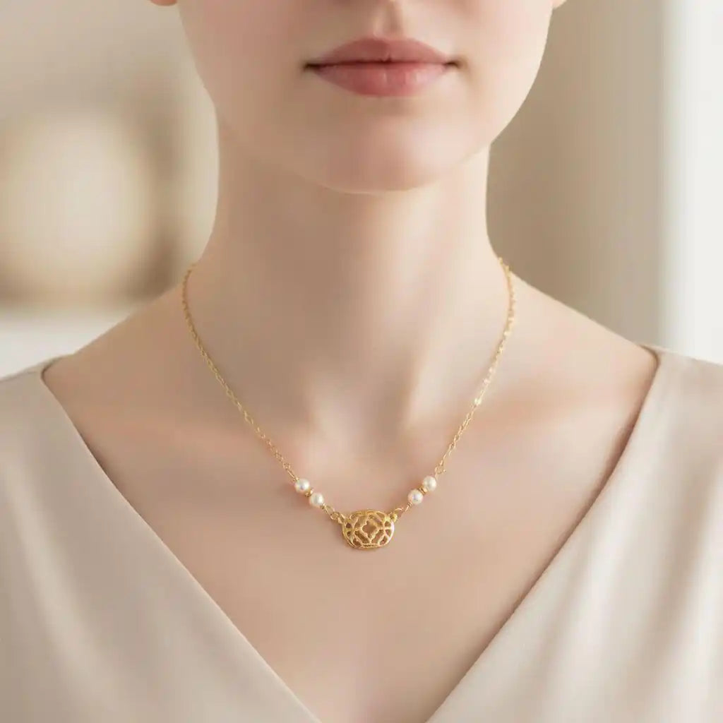 As Seen on Molly Ringwald Gold Filled Pearl Choker Necklace worn by a model with a neutral background.