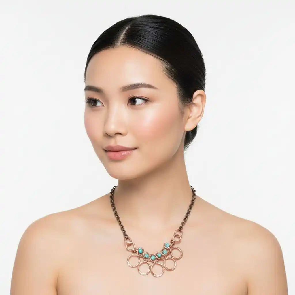 Seen on Ashley Liao Copper Turquoise Wire Wrapped Necklace worn by a model with a neutral background.