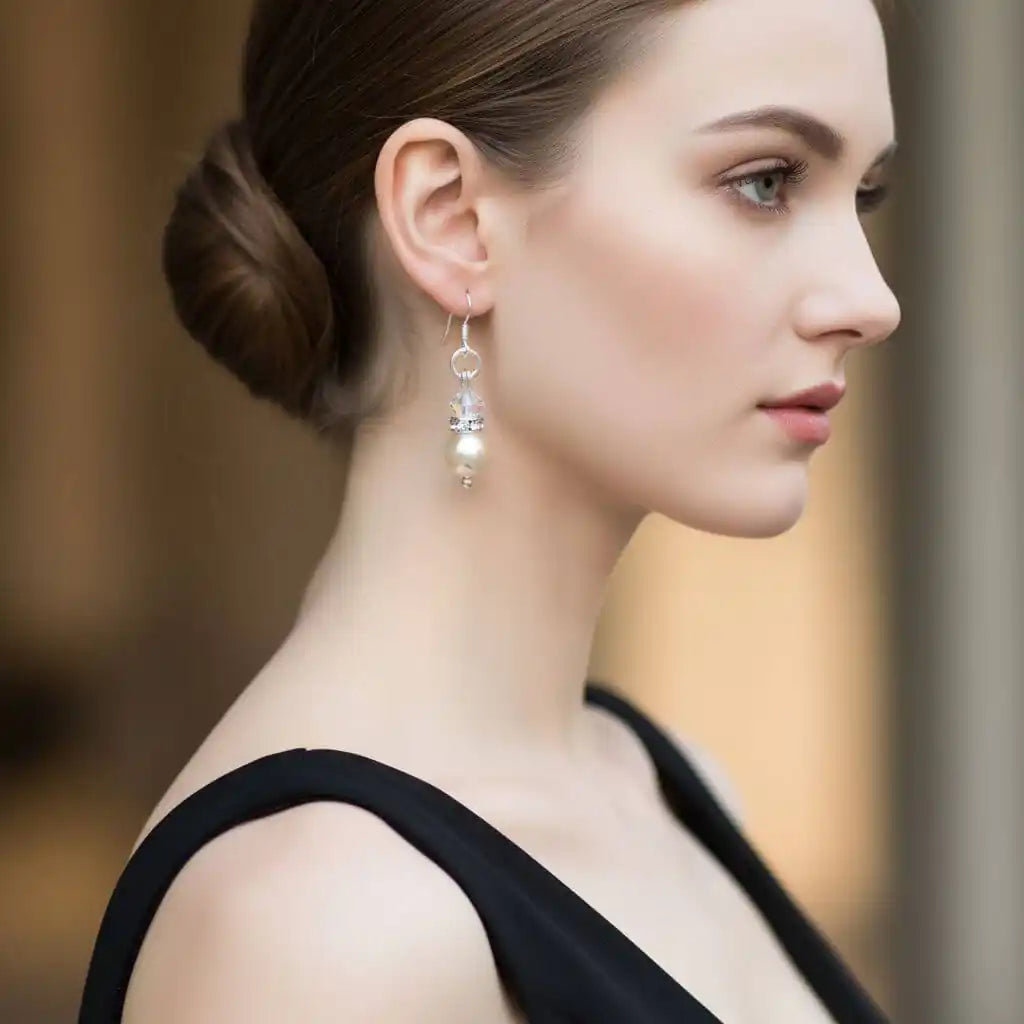A woman wearing Various Color Swarovski Crystal Pearl Stack Earrings, showcasing elegance and sophistication.
