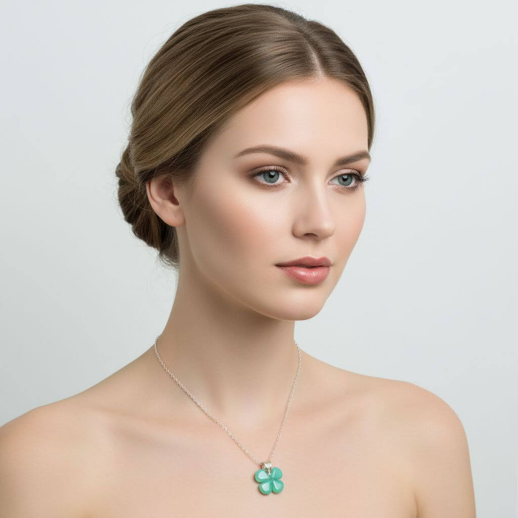 Mint green beaded clover necklace showcased on model, emphasizing its elegant design and color.