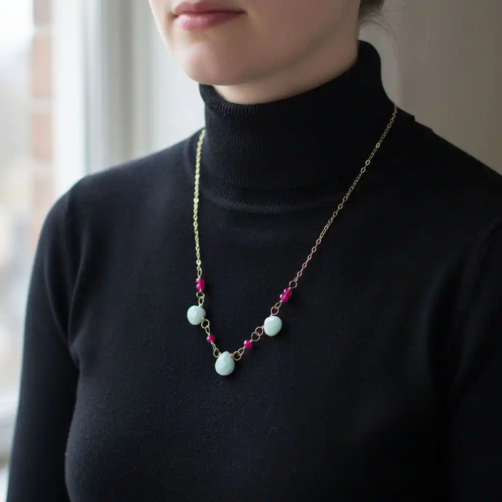 Dainty Gold Chain Mint and Hot Pink Gemstone Necklace worn by a model, showcasing mint and hot pink gemstones.