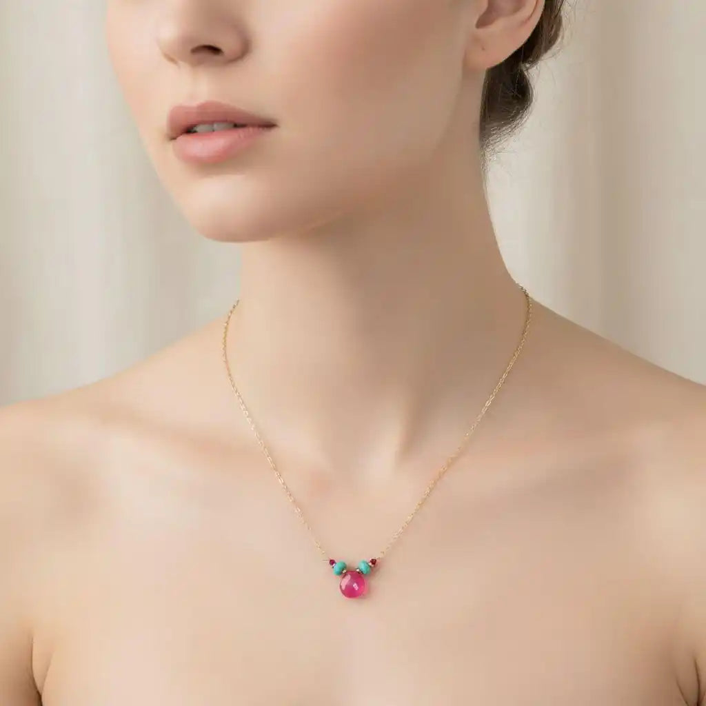 Gold Filled Turquoise and Pink Gemstone Drop Necklace worn by model, showcasing vibrant pink chalcedony and turquoise gems.