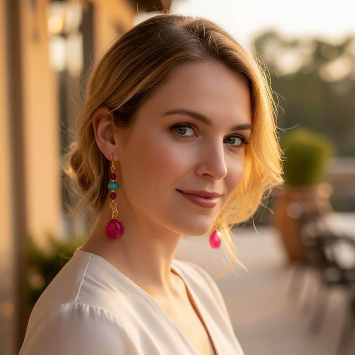 Gold Filled Wire Wrapped Pink Turquoise Gemstone Earrings worn by a woman, showcasing vibrant colors and elegant design.