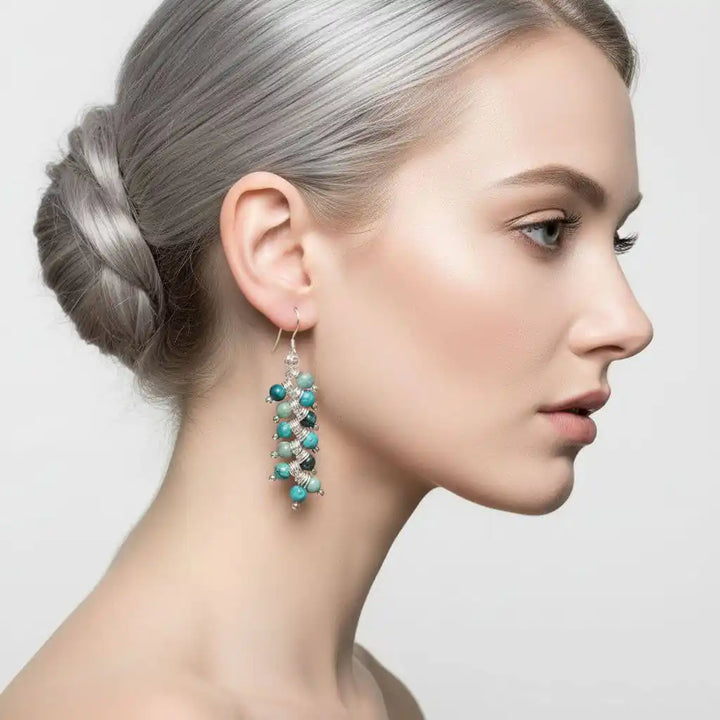 Seen On Jane The Virgin Silver Turquoise Wire Coil Earrings worn by a model with silver hair.