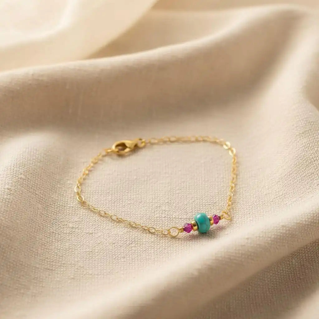 14K Gold Filled Pink and Turquoise Gemstone Dainty Bracelet on a soft fabric background