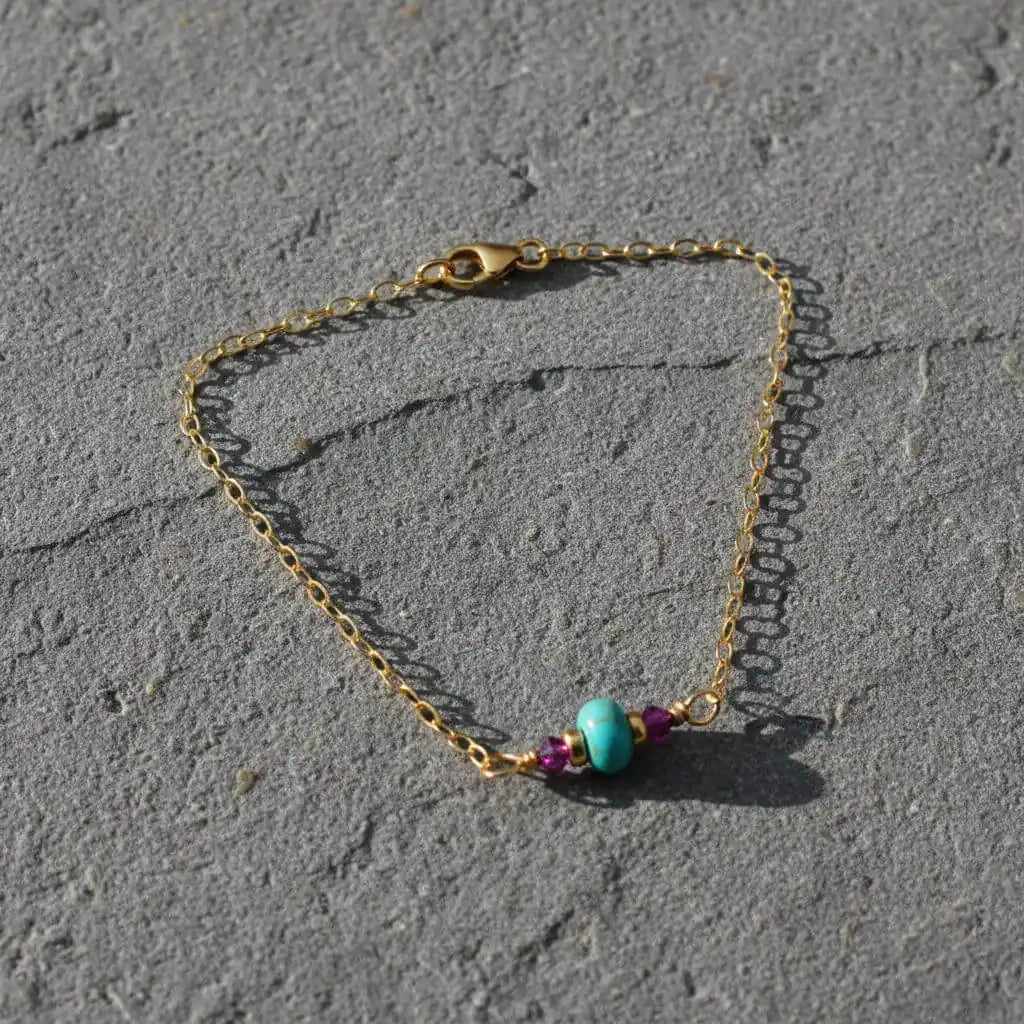 14K Gold Filled Pink and Turquoise Gemstone Dainty Bracelet showcasing vibrant turquoise and deep pink gemstones on a gold chain.