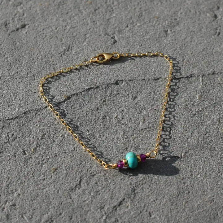 14K Gold Filled Pink and Turquoise Gemstone Dainty Bracelet showcasing vibrant turquoise and deep pink gemstones on a gold chain.