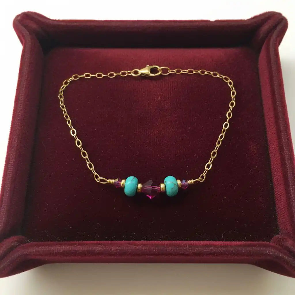 Handmade Gold Filled Pink Turquoise Gemstone Bracelet featuring turquoise beads and fuchsia crystals on a gold chain.