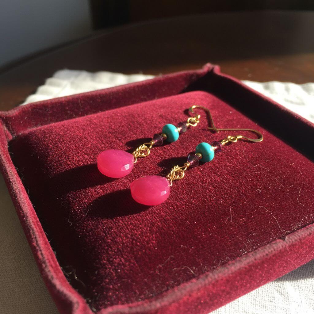 Gold Filled Wire Wrapped Pink Turquoise Gemstone Earrings displayed in a velvet box with vibrant pink chalcedony and turquoise beads.
