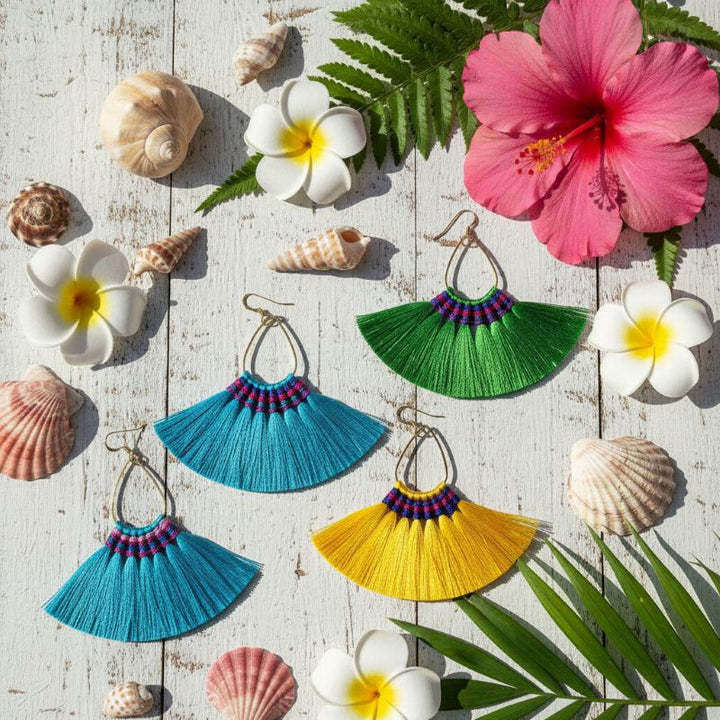 Handmade Hawaii Hula Skirt Rayon Silk Tassel Hoop Earrings displayed with tropical flowers and seashells