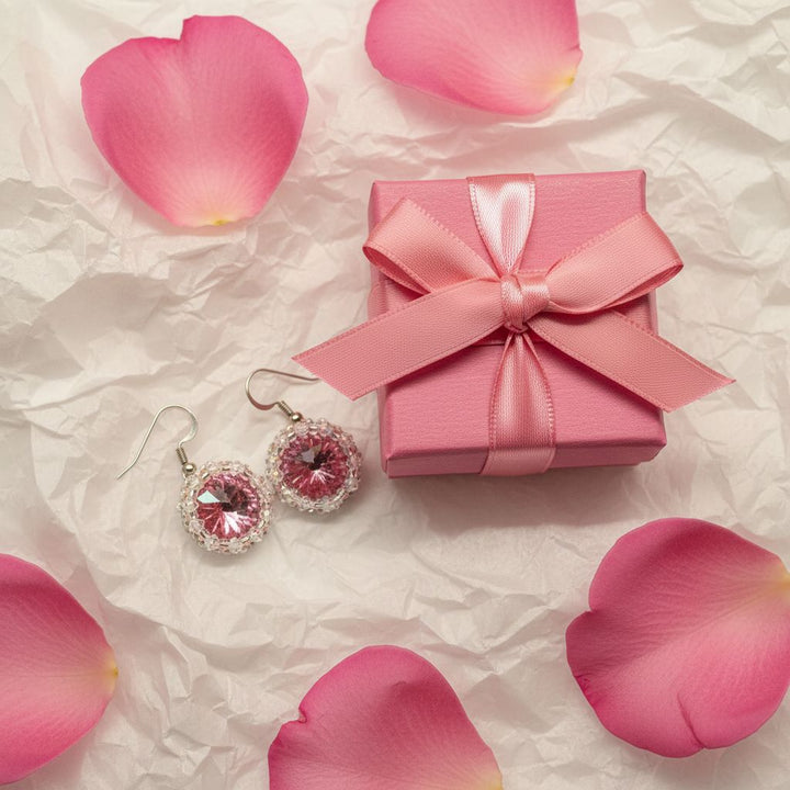 Handmade Beaded Bezel Pink Crystal Halo Earrings displayed with a pink gift box and rose petals.