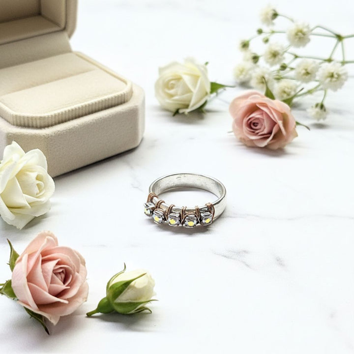 Rose Gold Filled Wire Wrapped Sparkly Crystal Bling Ring displayed with roses and a ring box, showcasing elegant handmade jewelry.
