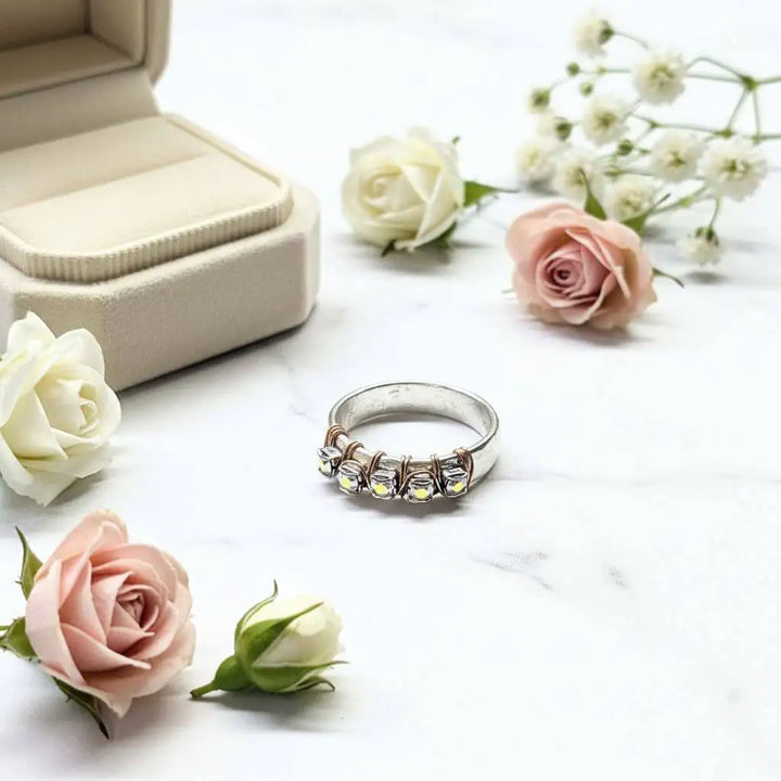 Rose Gold Filled Wire Wrapped Sparkly Crystal Bling Ring displayed with roses and a ring box, showcasing elegant handmade jewelry.