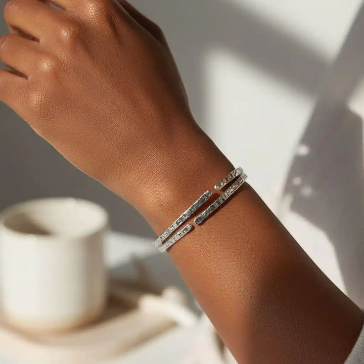 10 Gauge 925 Silver Hammer Textured Bangle worn on a wrist, showcasing its shine and elegant texture.