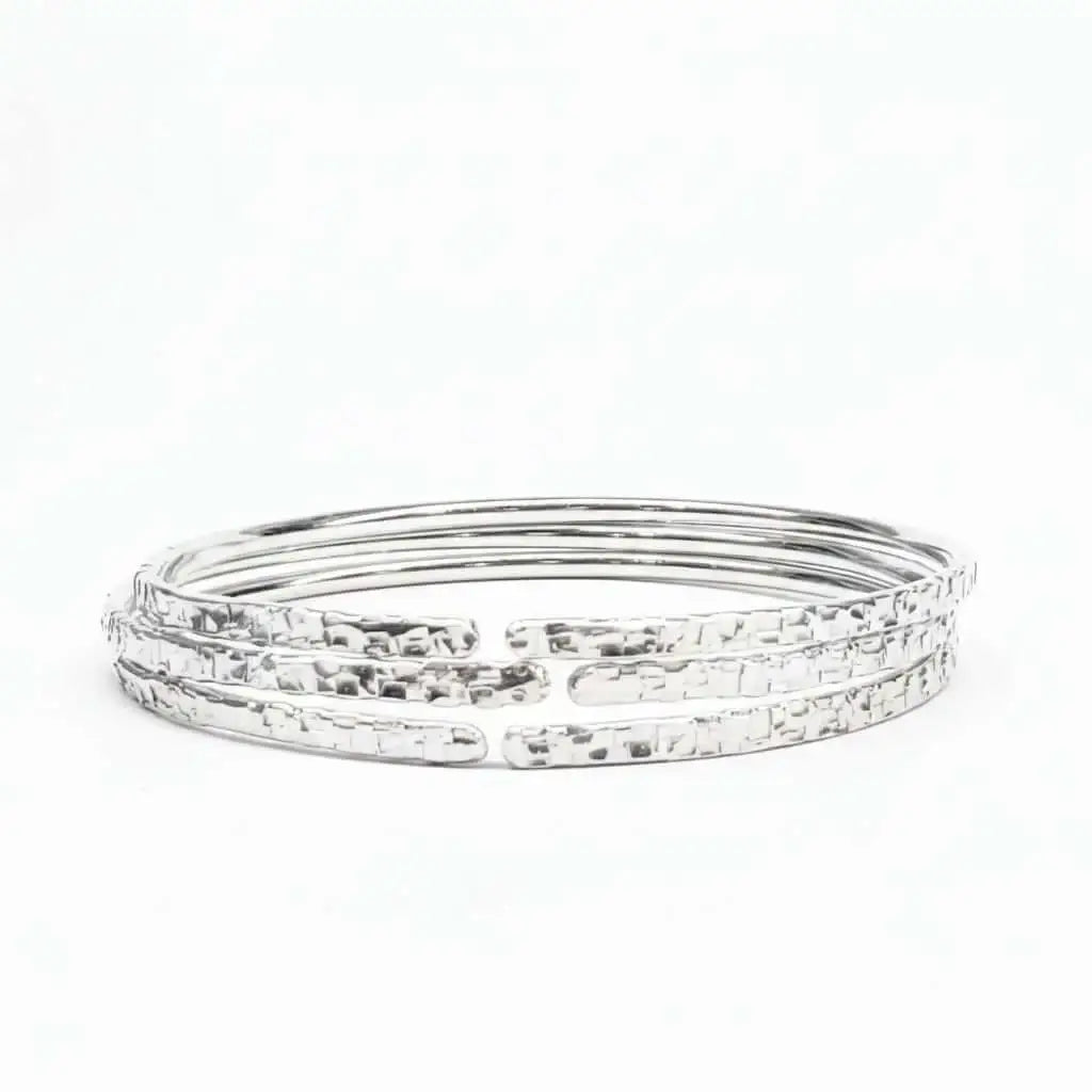 10 Gauge 925 Silver Hammer Textured Bangle showcasing a shimmering, intricate design with a hammered finish.
