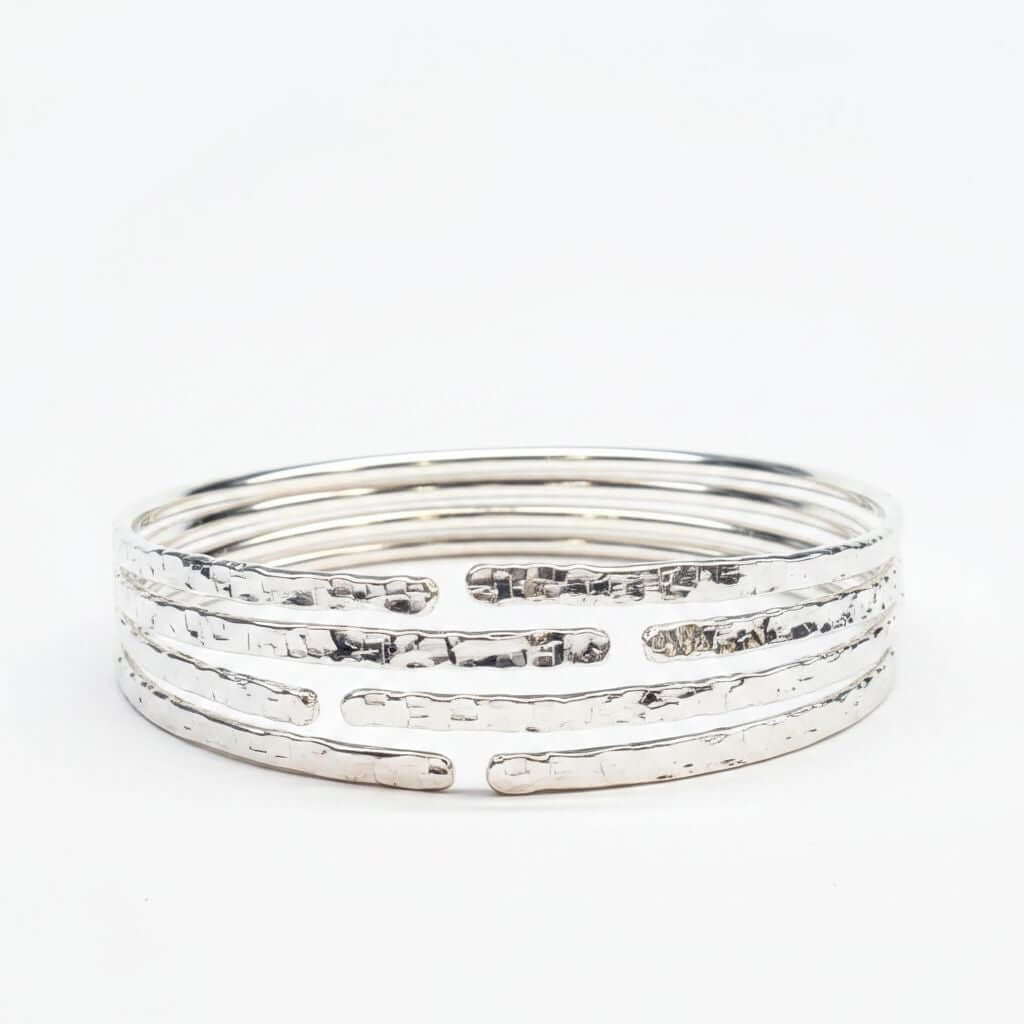 10 Gauge 925 Silver Hammer Textured Bangle showcasing a hammered design with multiple stacked bangles.