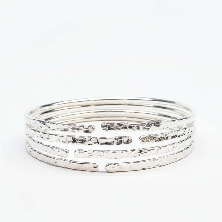 10 Gauge 925 Silver Hammer Textured Bangle showcasing a hammered design with multiple stacked bangles.
