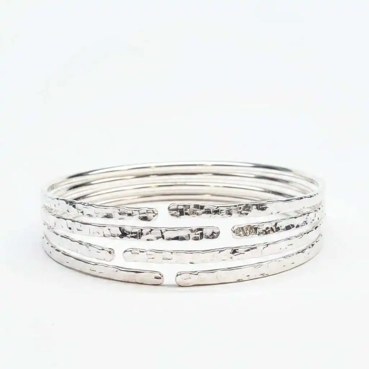 10 Gauge 925 Silver Hammer Textured Bangle showcasing a hammered design with multiple stacked bangles.