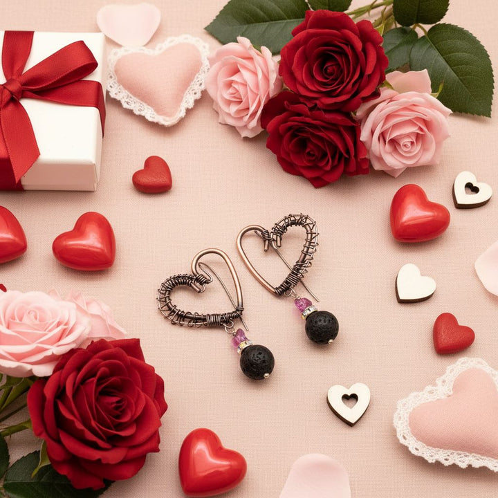 Copper Sculpted Heart Hoop Crystal Butterfly Lava Rock Earrings displayed with roses and hearts.