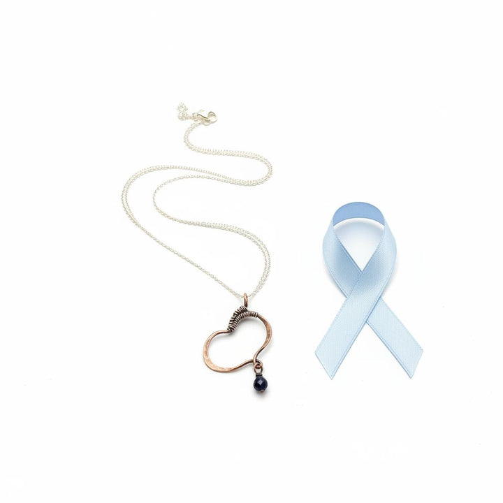 Hammered Copper Butterfly Wing Child Abuse Survivor Necklace with blue awareness ribbon