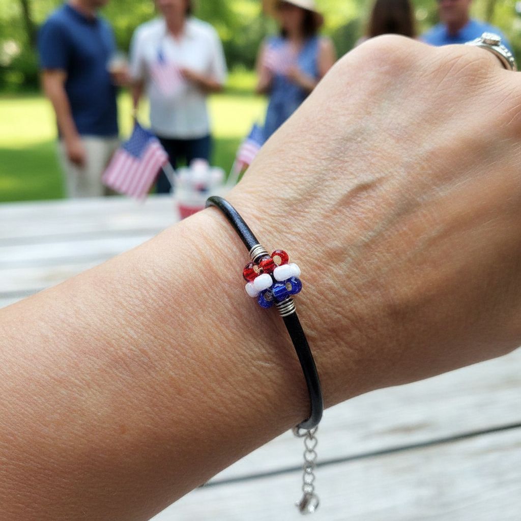 Patriotic Red White Blue Beaded Bead Leather Bracelet worn on wrist at outdoor gathering with people in background.