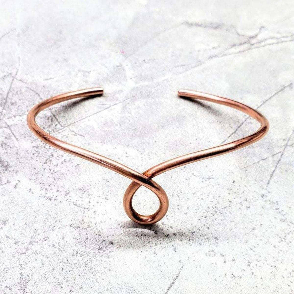Handmade Sculpted Copper Teardrop Bangle showcasing unique teardrop design in sturdy 10-gauge copper wire.